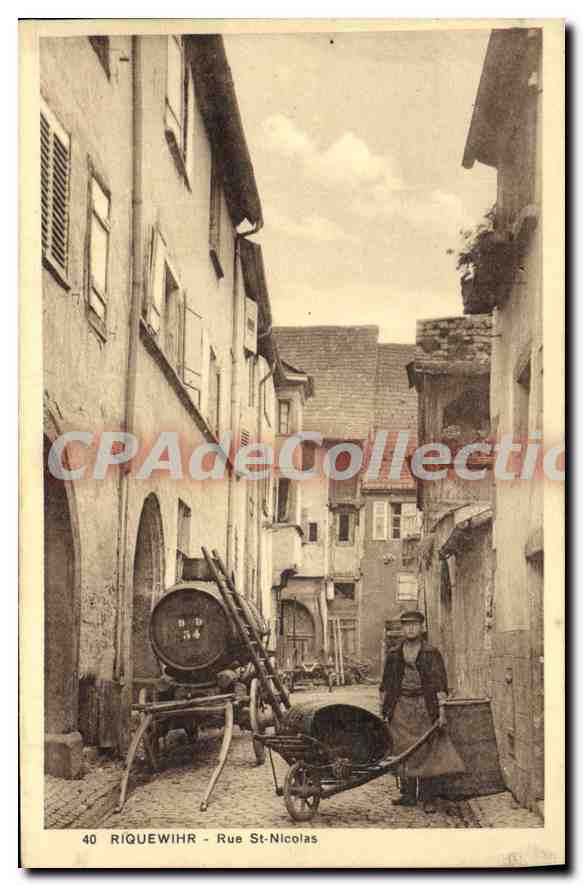 Riquewihr - St-Nicolas Street — View of a narrow street with a man and a barrel — Wibeco edition, no. 40