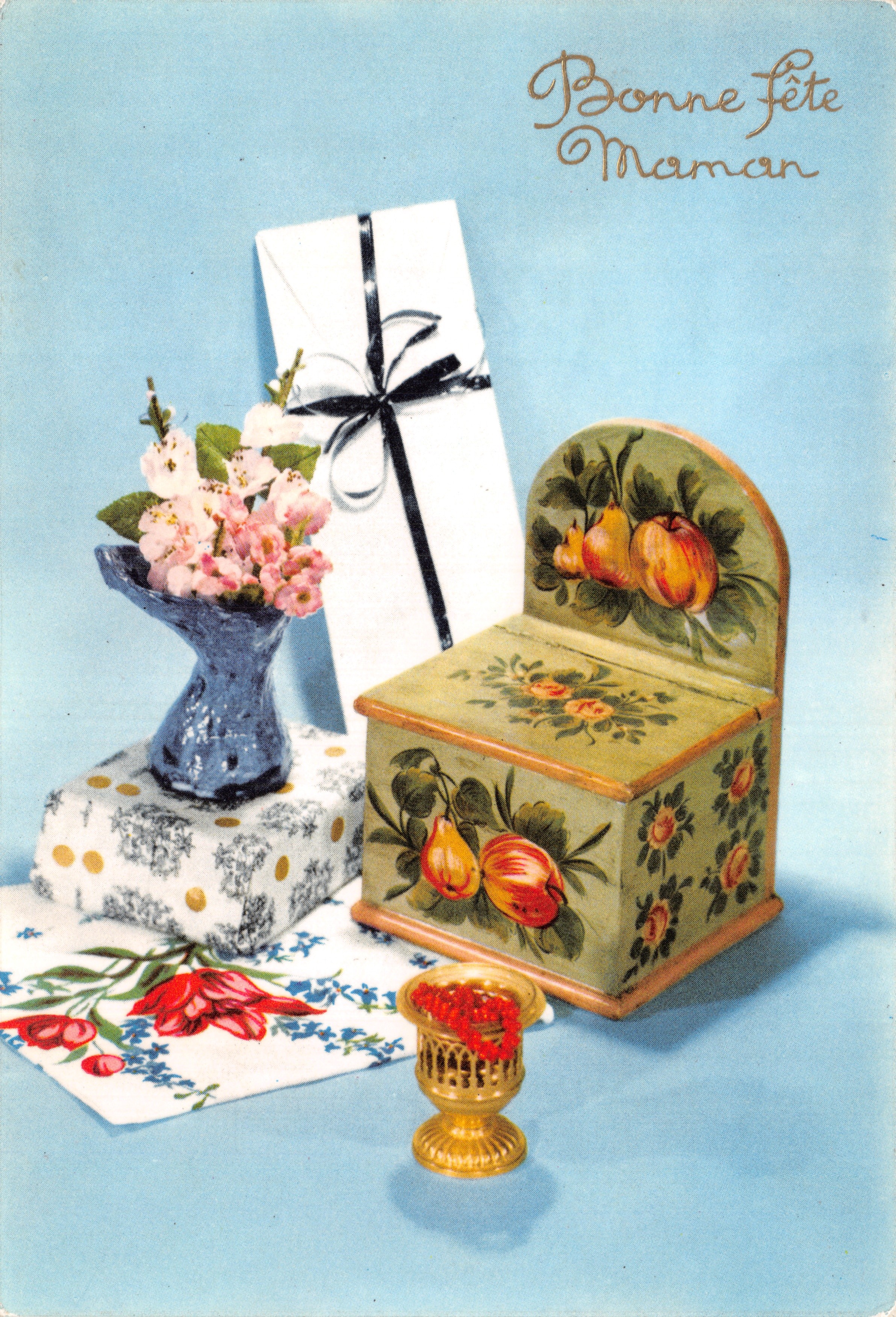 Fête de la Maman — scène de table avec fleurs, cadeau et boîte décorée — éditeur Néotélon