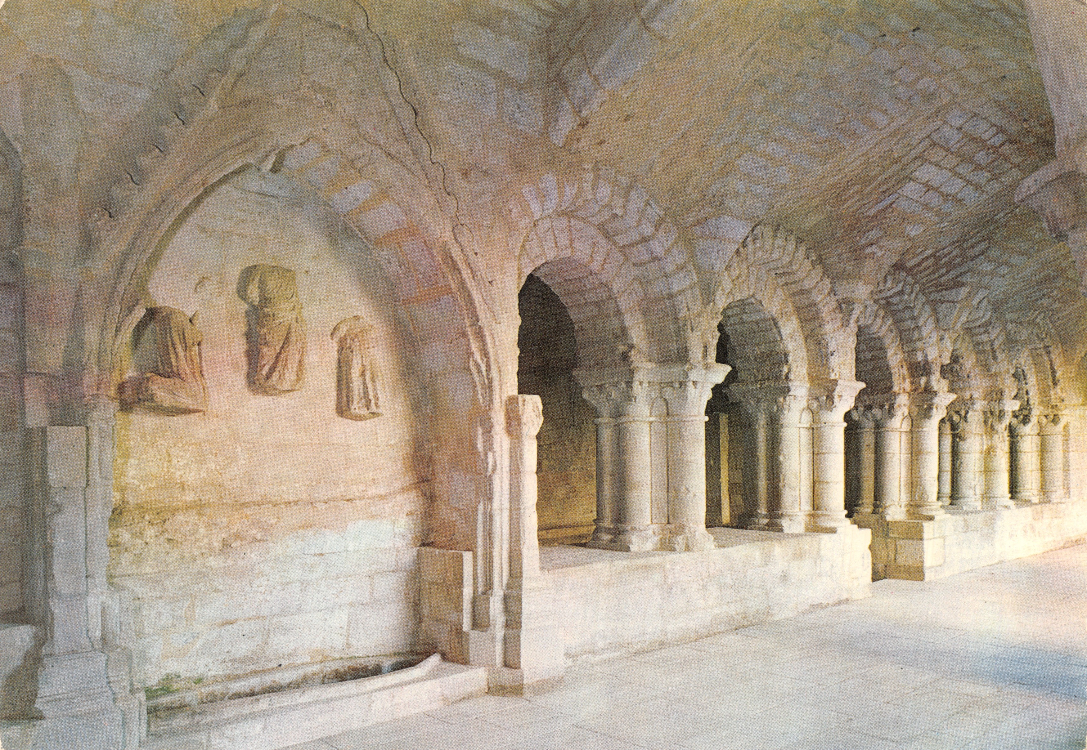 Cloister of the Neuilly-sur-Aube Abbey — interior view with carved capitals — publisher ELIOPHOT