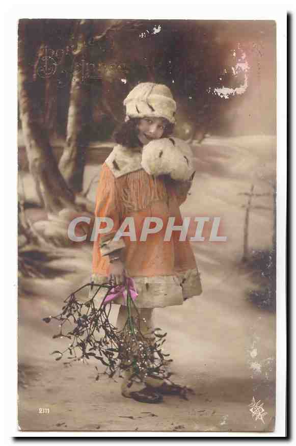 Girl in winter attire — with a larch branch — photographer D. Heinzen