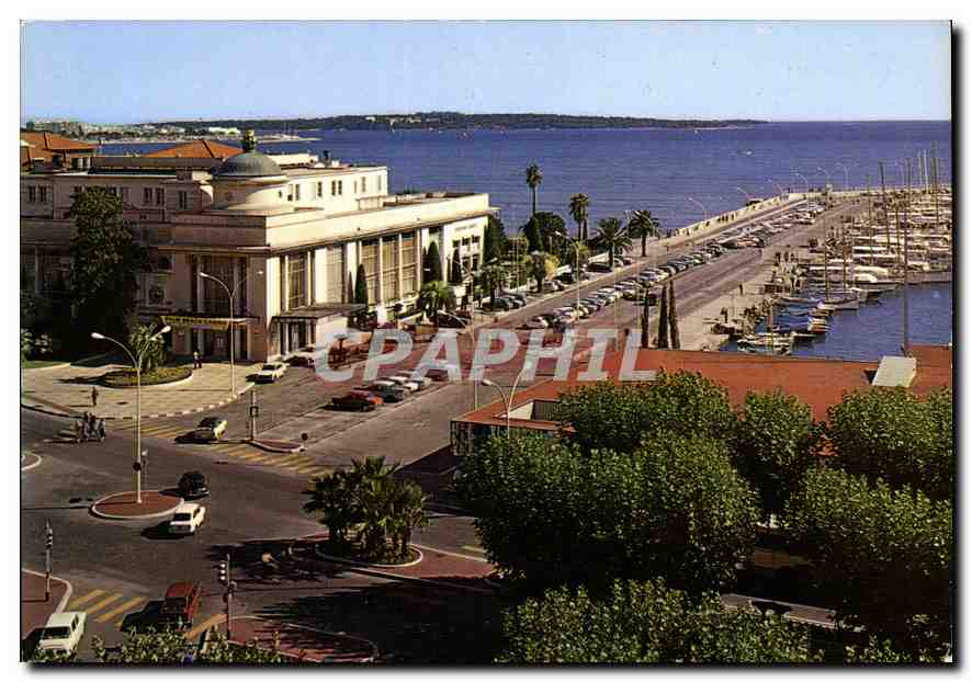 CPM Cannes Le Casino Municipal et un coin du Port Dans le lointain les Iles de Lerins Vue prise de l