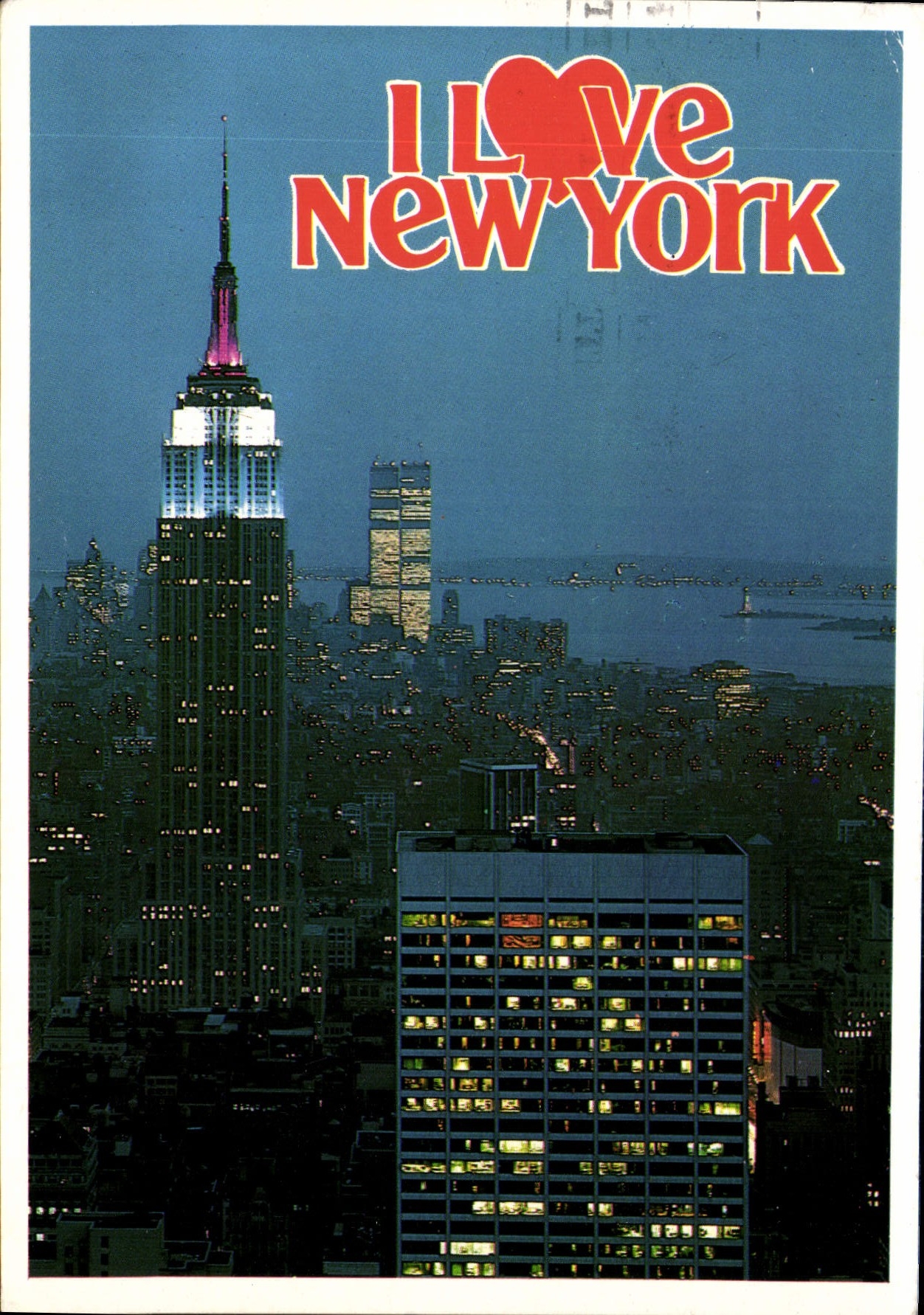 CPM New York Illuminated Empire State Building with the twin towers of the World Trade Center in the