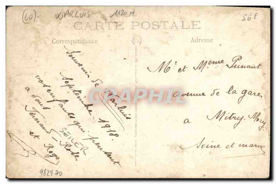 Familia delante de una casa de ladrillo — n° 60 — Reverso