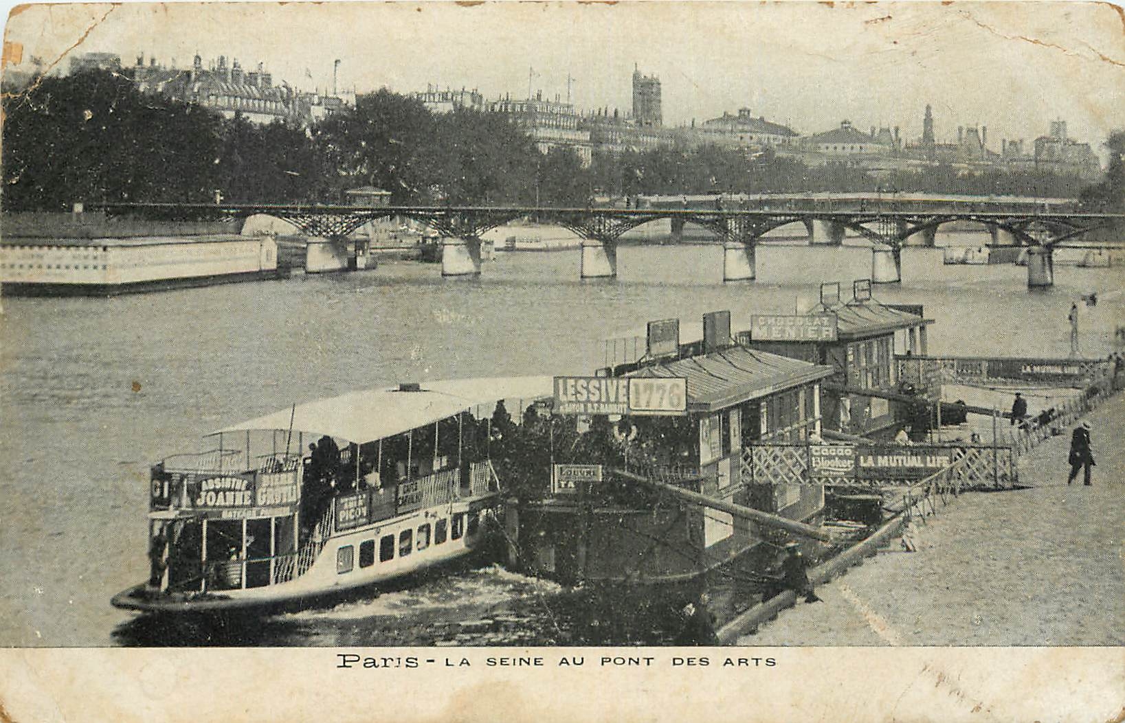 Paris - La Seine au Pont des Arts — vue avec bateau et quai publicitaires