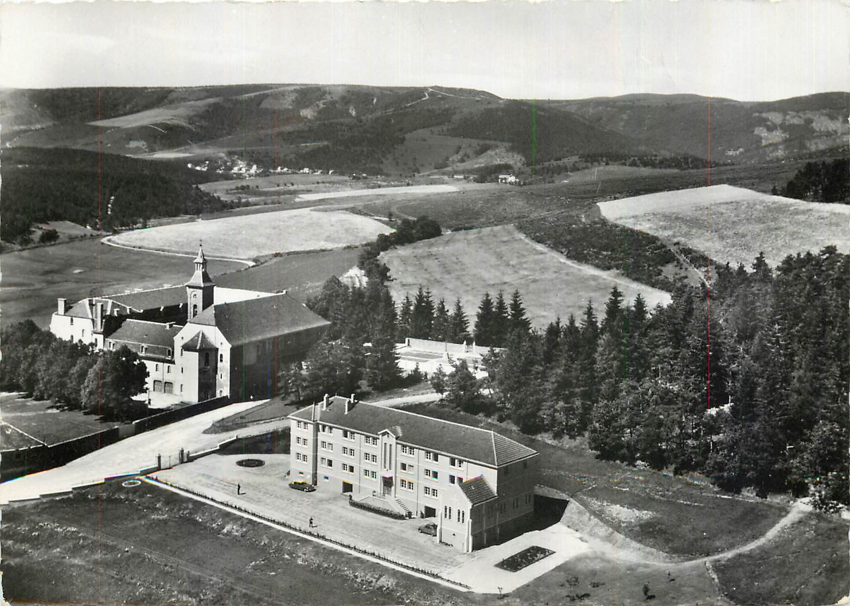 CPM Abbaye Notre Dame des Neiges par la Bastide Lozere Le Monastere dans son cadre boise 