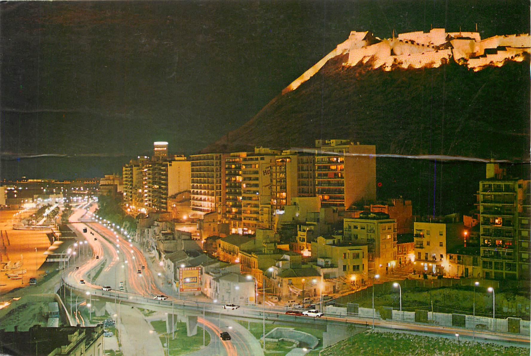 CPM Alicante Vista nocturna Castillo y Playa del Postiguet 