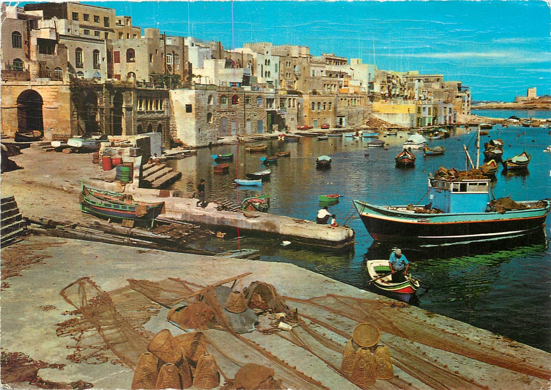 CPM Malta St Julians Fishermen's nets and boats in this delightful creek 