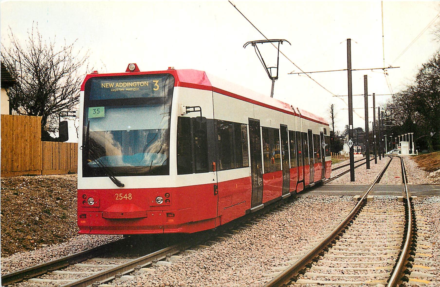 CPM Croydon Tramlink Standard liveried Tram No. 2548 approaches Lloyd Park stop on its journey to Ne