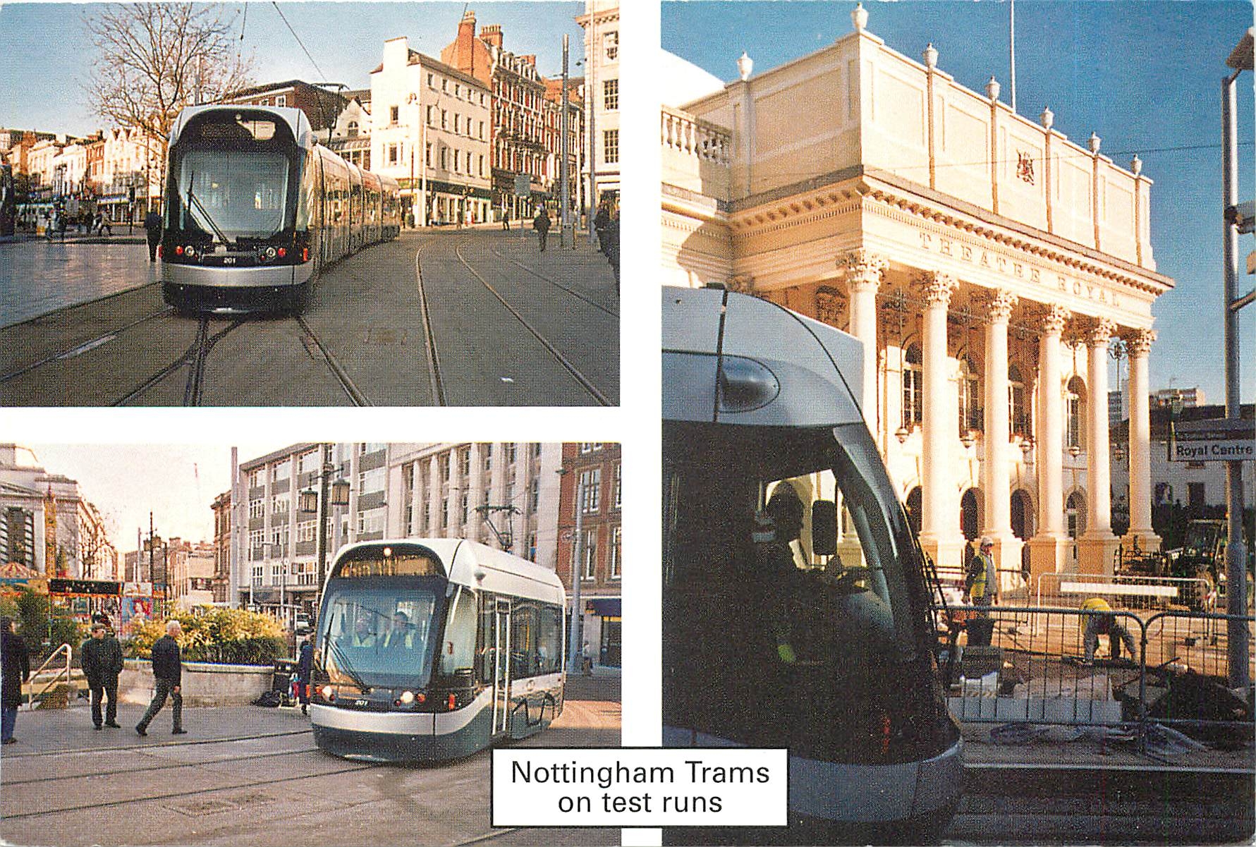 CPM Nottingham trams on test runs in Old Market Square and passing Theatre Royal in December 2003