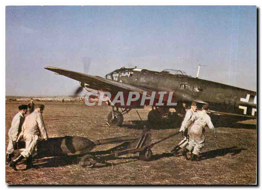 CPM An SC 500 bomb is manhandled into position beside a Heinkel He 111H 6 of KG55 on the Eastern Fro