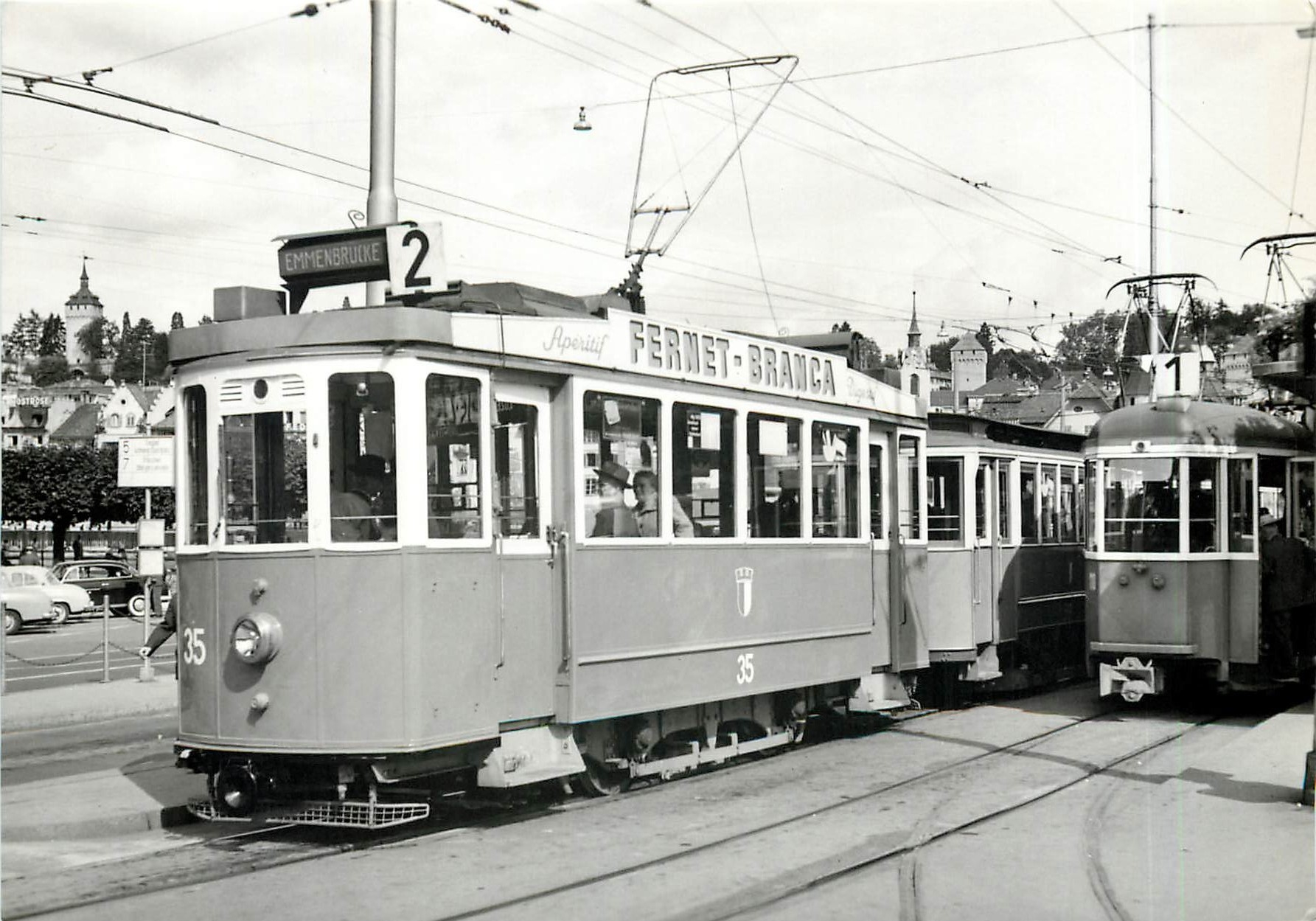 CPM Tram Luzern Ce 2/2 35 mit Anhaengewagen ex Basel beim Bahnhof Luzern Fernet Branca