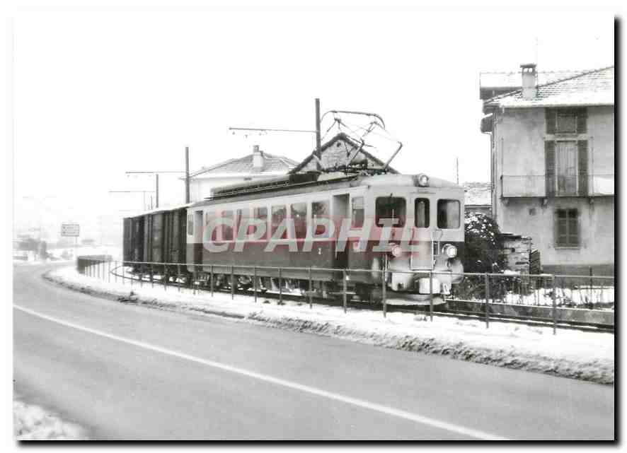 CPM Winterlicher Gueterzug entlang der 1961 erstellten Umfahrungstrasse bei Biasca