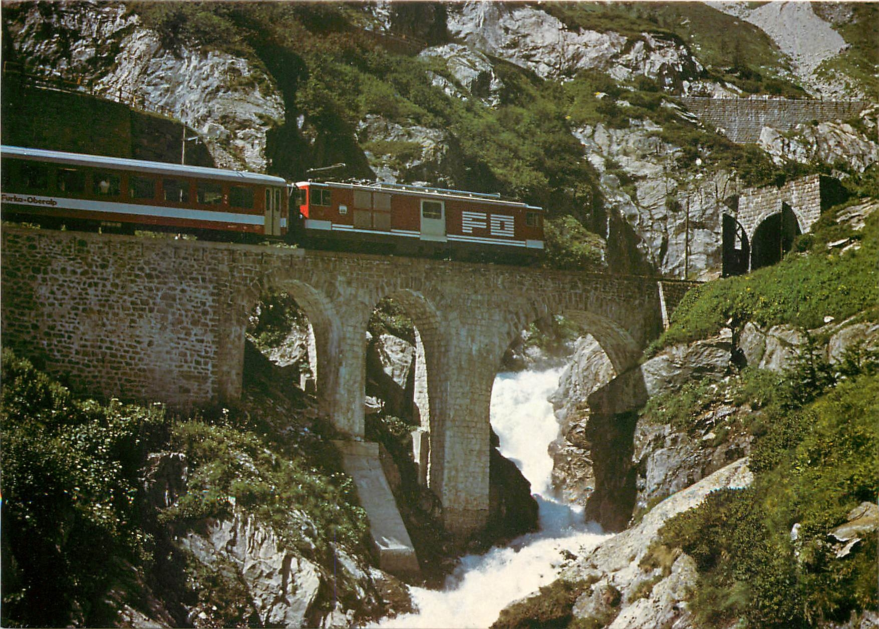 CPM Der Glacier-Express mit Furka-Oberalp-Lokomotive Hge 4/4 34 + leichtein BVZ-B +RhB-A + FO-B