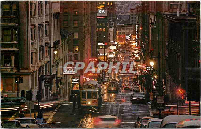 CPA Busy Cable Cars climb the steep terraced Powell Street Hill at twilight time San Francisco Calif