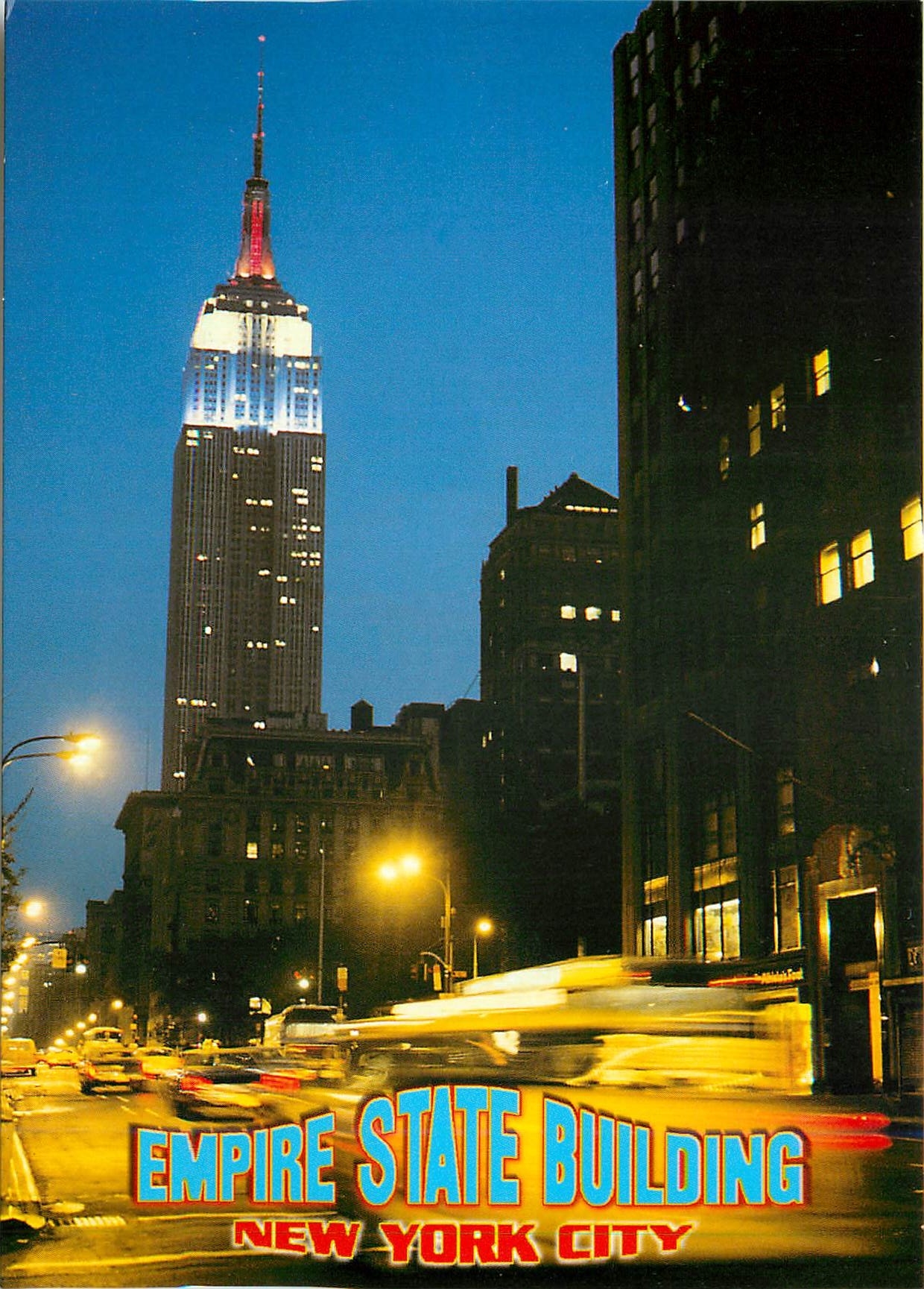 CPM The empire state Building illiminated at night standing 102 floors above the street