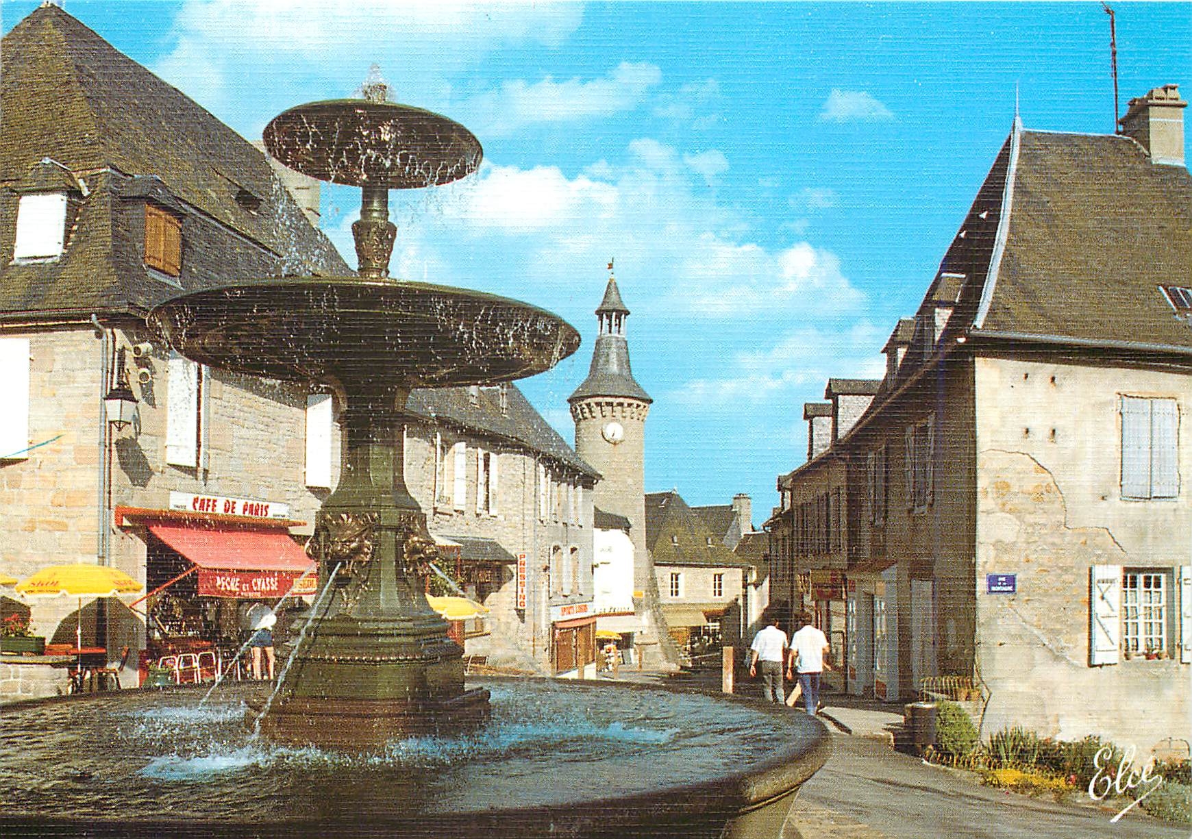 CPM Meymac La Grande Rue et la Fontaine 
