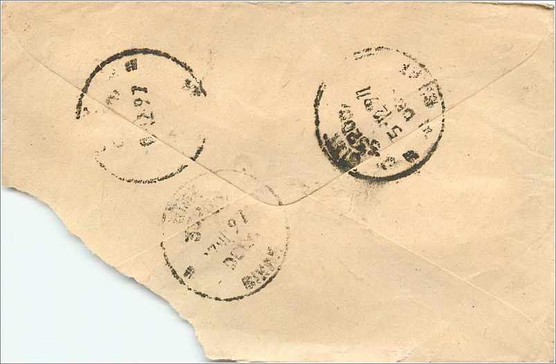 Carte postale indienne — texte manuscrit en devanagari — timbres et oblitérations visibles — Reverso
