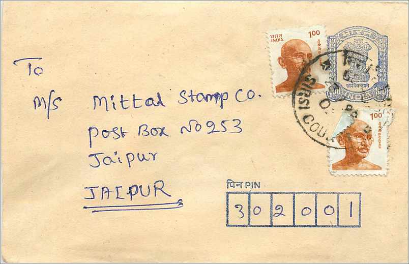 Postkarte an die Mittal Stamp Co. in Jaipur — Gandhi-Stempel und Kupferstempel 'FIRST COU' — Indien