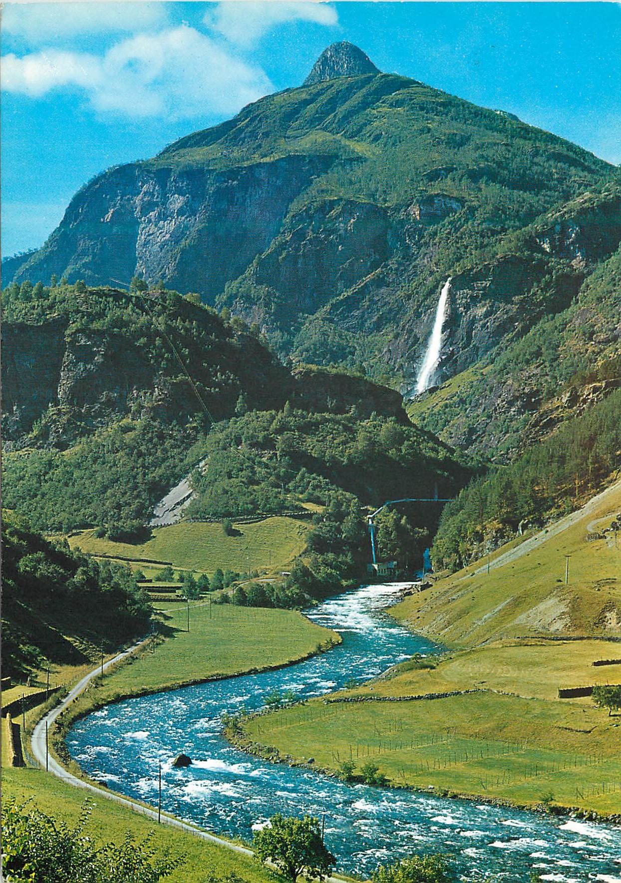 CPM Norway View from the Flam railway towards Rjoandefossen waterfall which drops precipitously down mount Vibmesnosi 