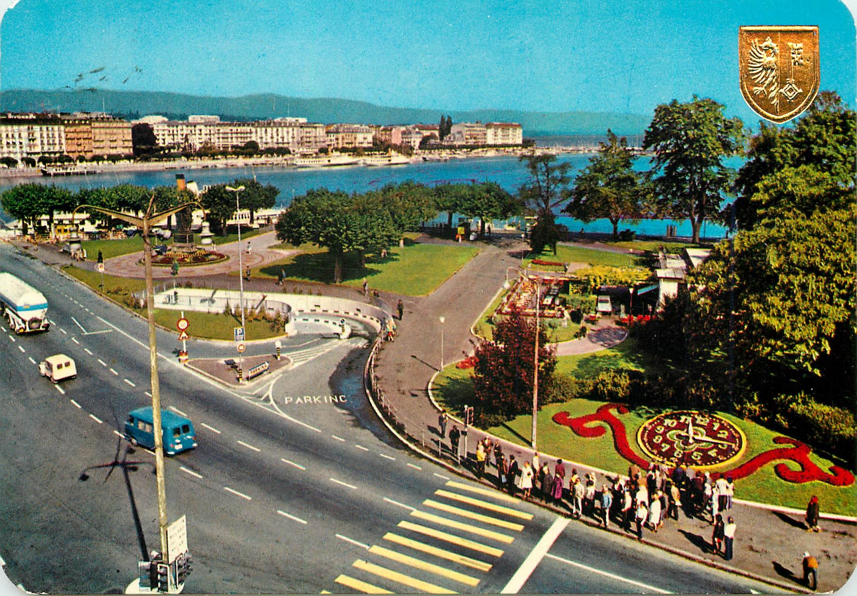CPM Geneve L horloge fleurie et l entree du parking sous lacustre 