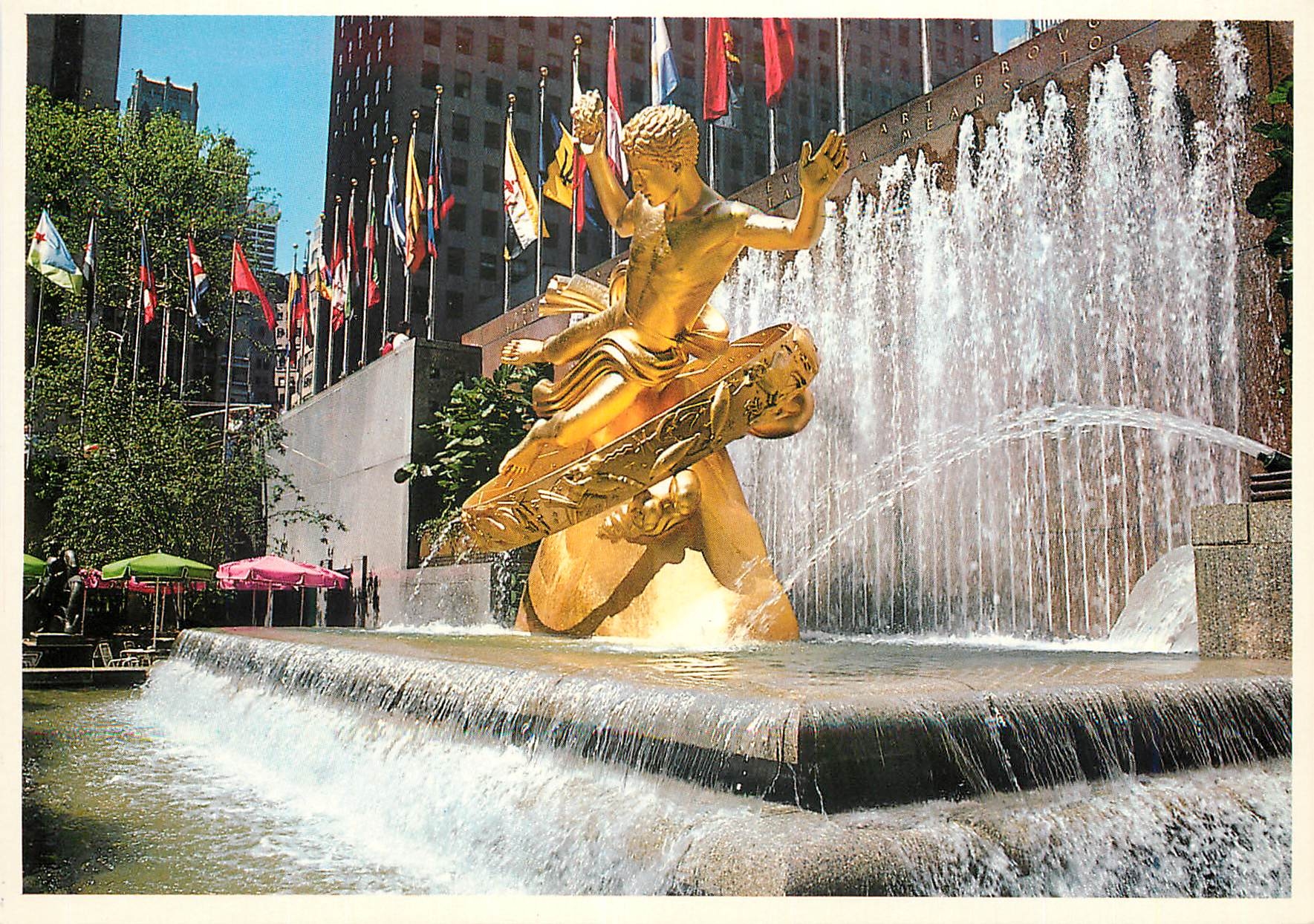 CPM New york city rockefeller prometheus statue with the flags of the world in the background