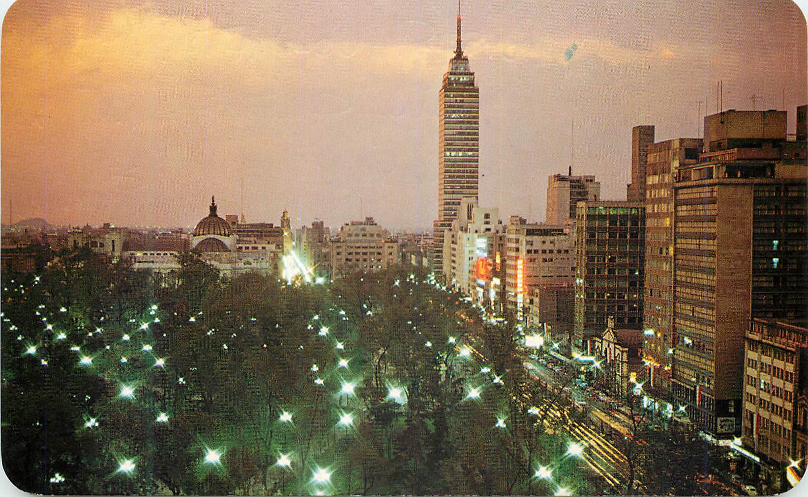 CPM Twilight over Mexico City. The Alameda is to the front the Latin American Tower to the back MEXICO