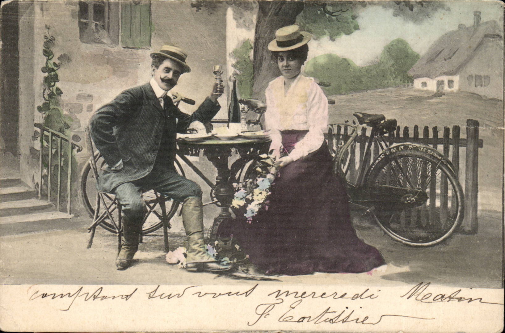 Couple à table — scène de jardin avec vélo — éditeur K.V.L.B. n°12