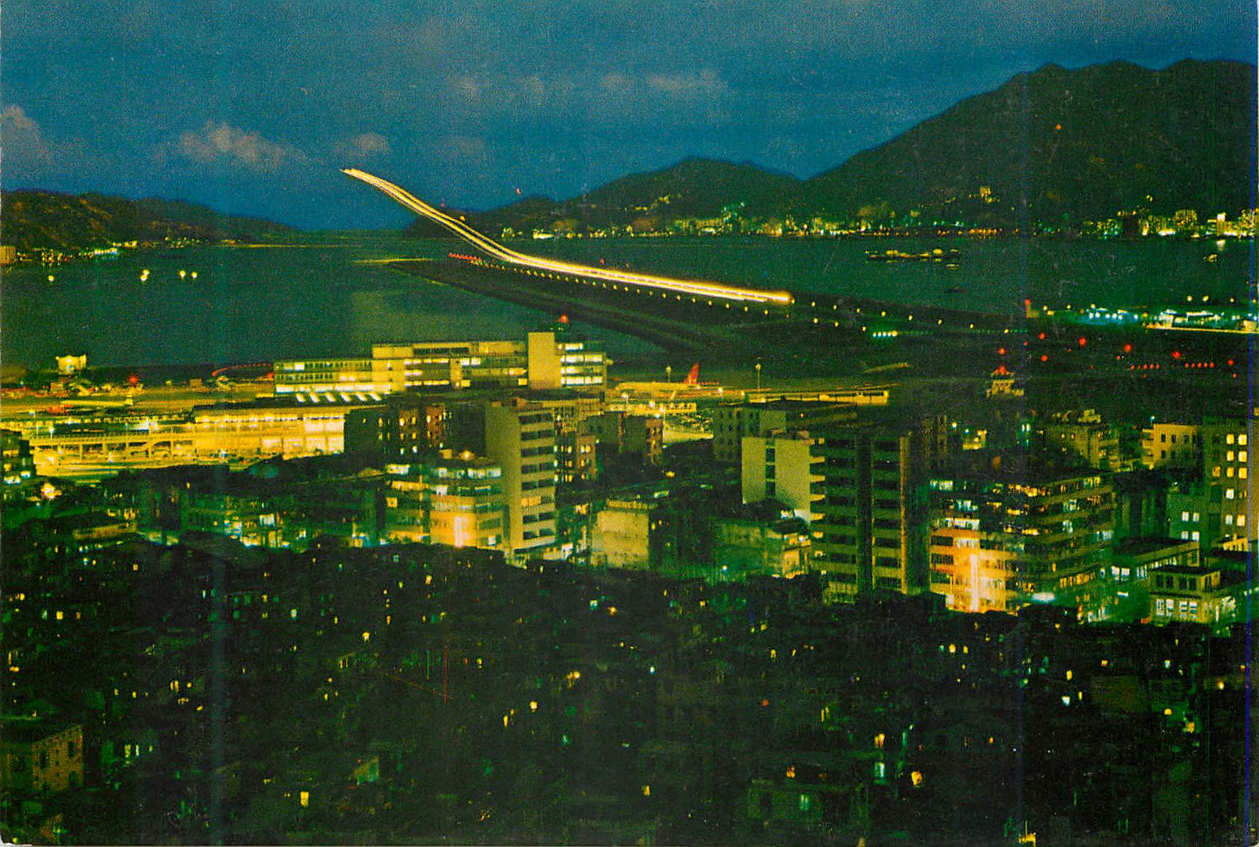 CPM Hong Kong Kai Tak Airport at night with its Modern funway illuminated