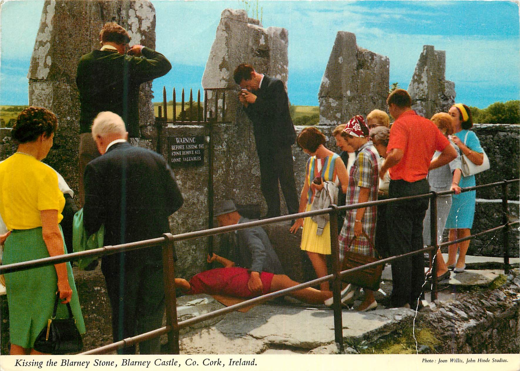 Kissing the Blarney Stone, Blarney Castle, Co. Cork, Ireland — Photo : Joan Willis, John Hinde Studios