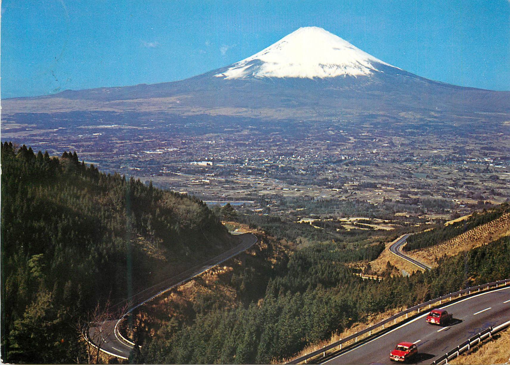 CPM Mt Fuji The Holy Peak of Japan Releals its Perfect Cone Against Blue Sky In the Loreground is Gotenba City