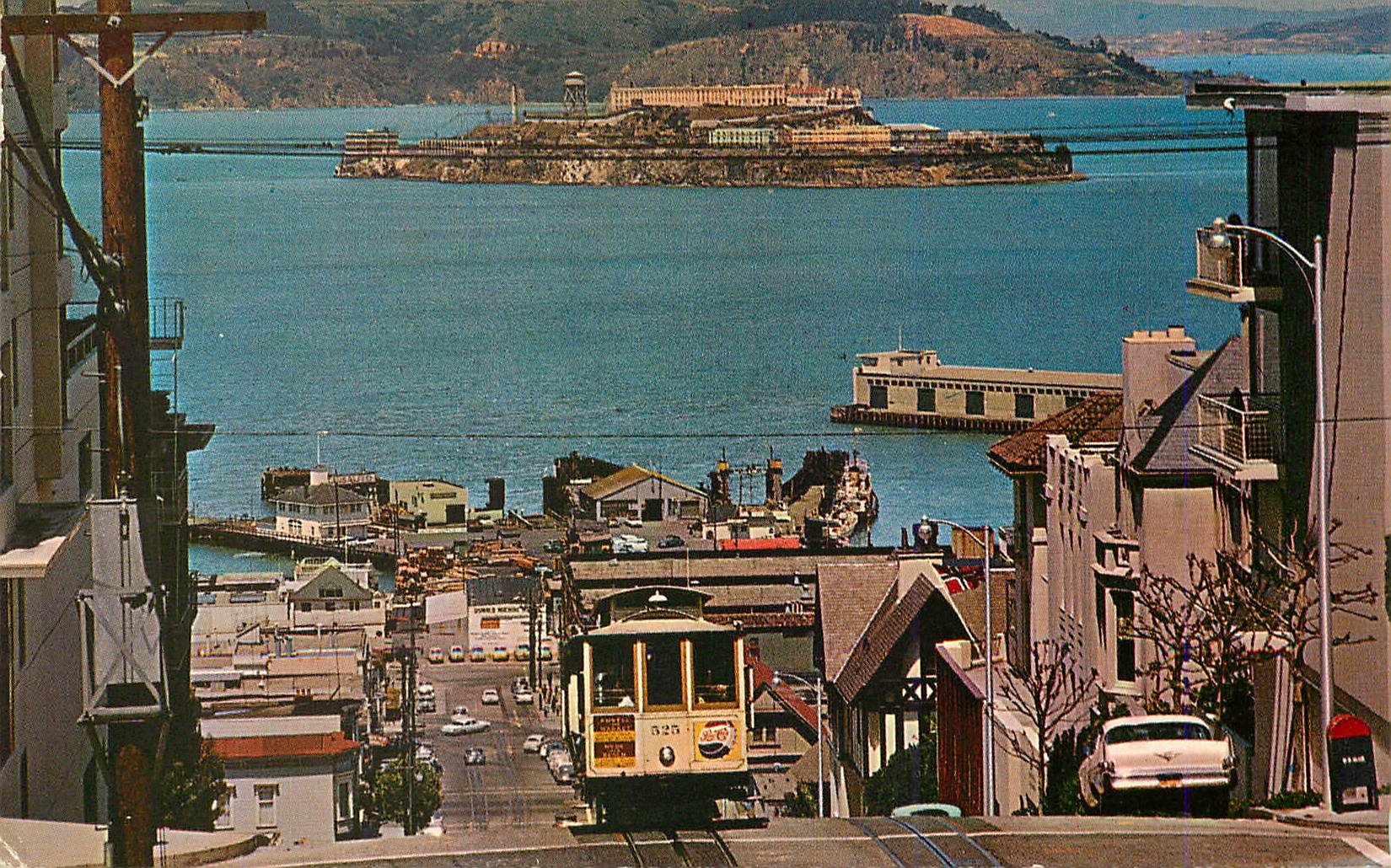 CPM Cable Car on San Francisco Hill the Cable Car climbing the Steep Hyde St Hill Alcatraz and the San Francisco Bay in 