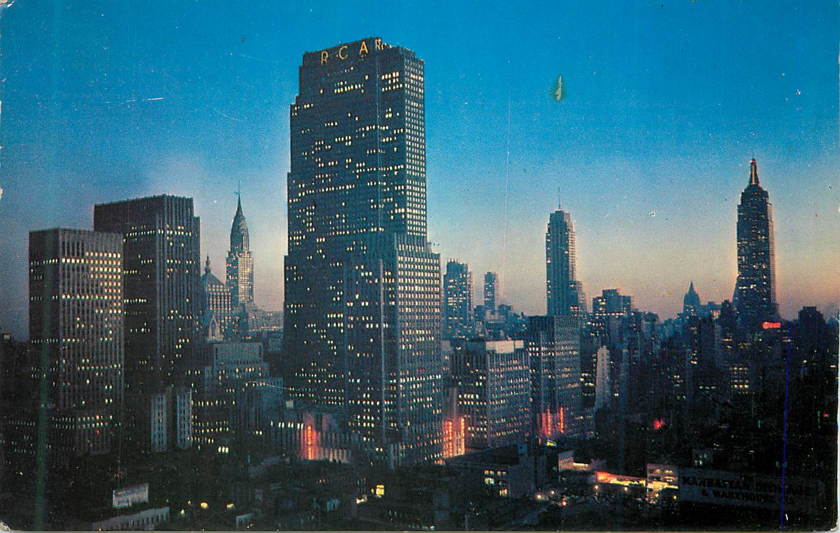 CPM Night falls on Midtown Manhattan Showing RCA Building Chrysler Building and Ampire State Building