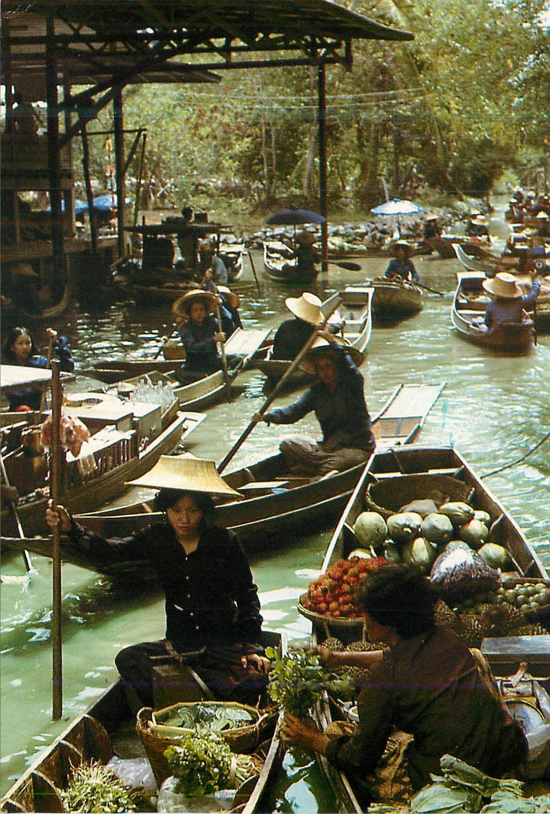 CPM Boat Vendors Playing Along a Klong Part of the Floating Market Scene at Damnoen Saduak