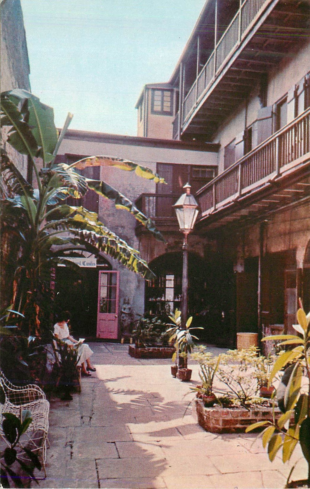 CPM Courtyard Candles Royal Street New Orleans Louisiana is typical of the French Quarter