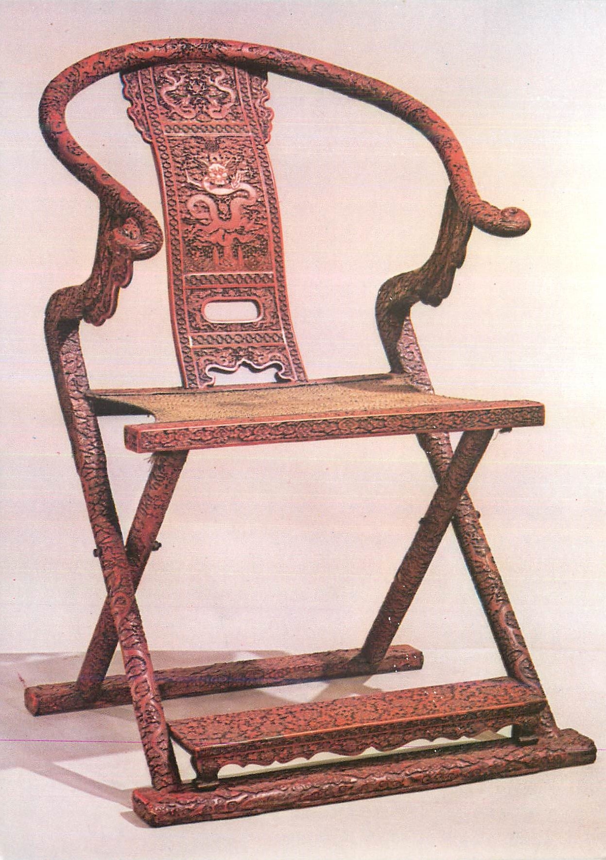 CPM Imperial Folding Chair Carved red lacquer on wood Decorated with dragons and phoenixes Victoria and Albert Museum  C