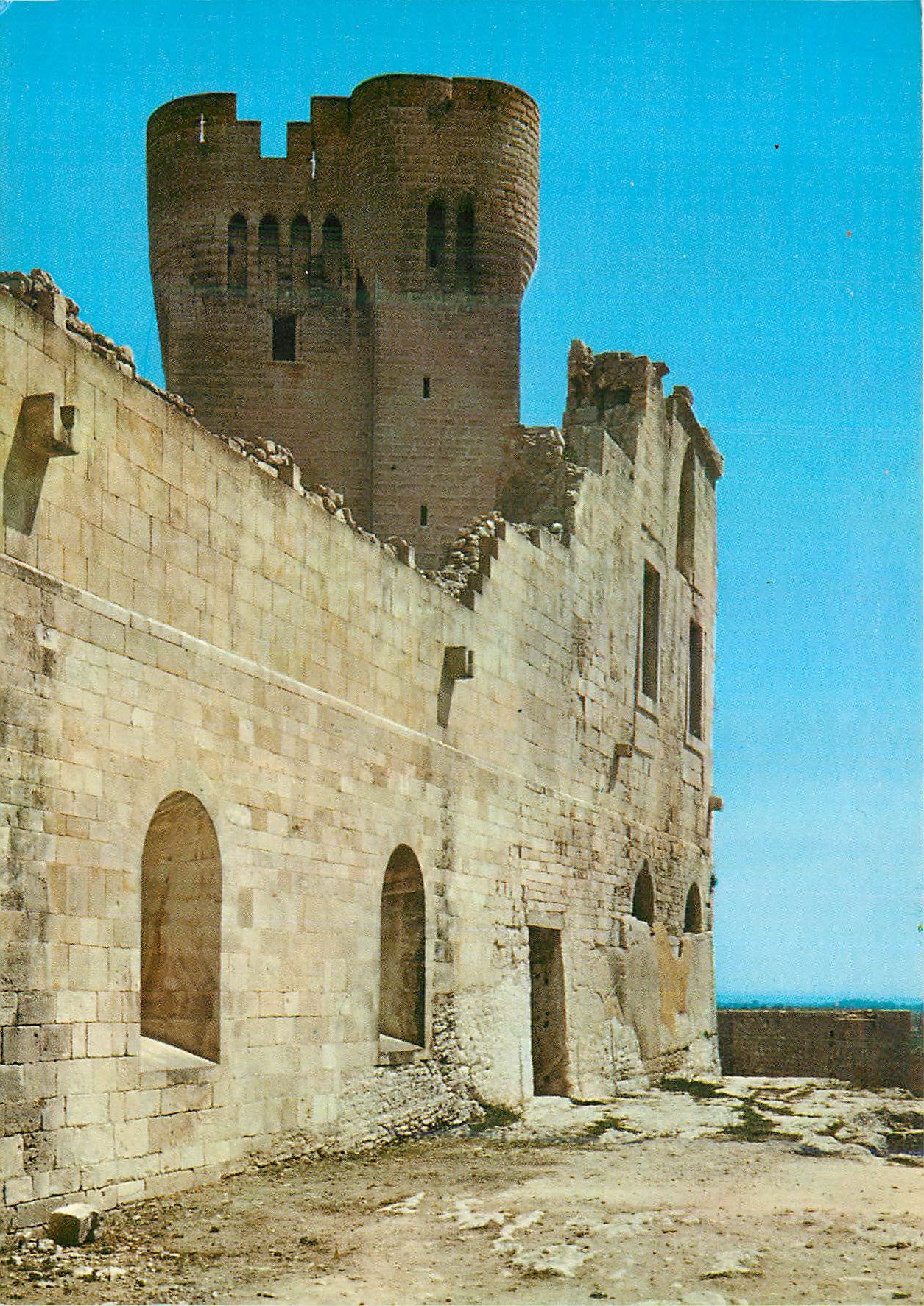 Château de Sant Ferran — ruins with cylindrical tower — publisher not visible