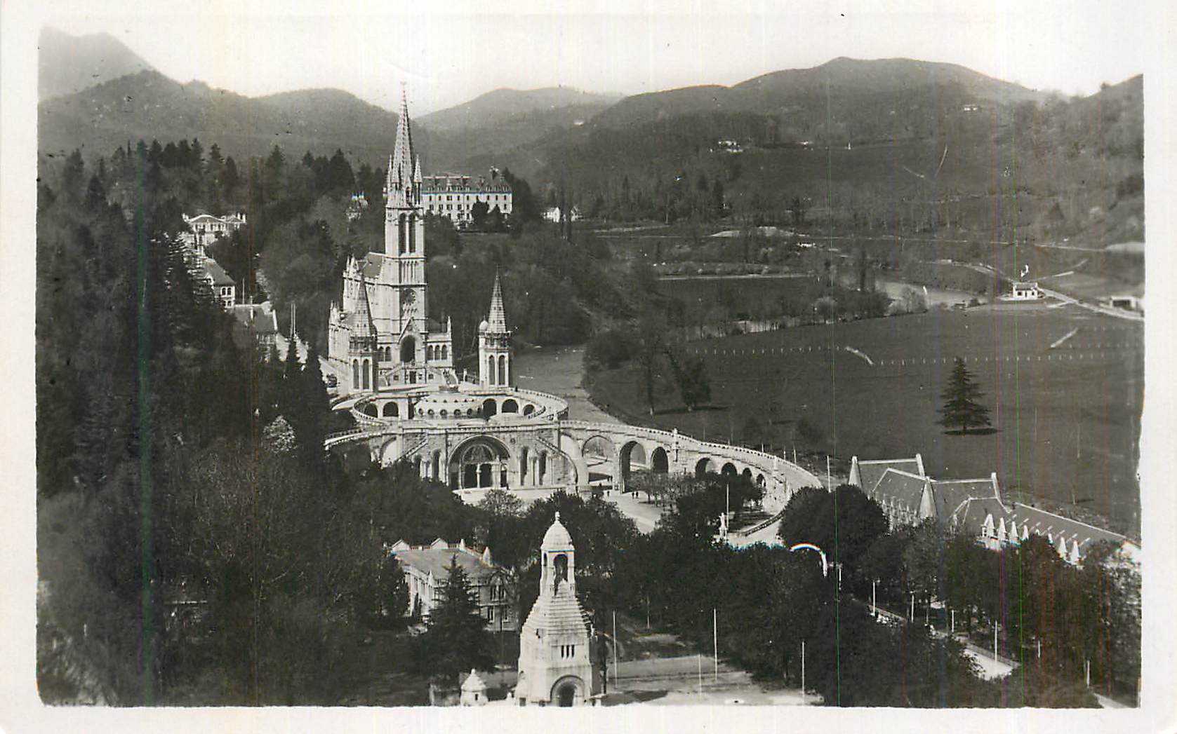CPM Lourdes La Basilique et le Monument Interallie vus du Chateau Fort 
