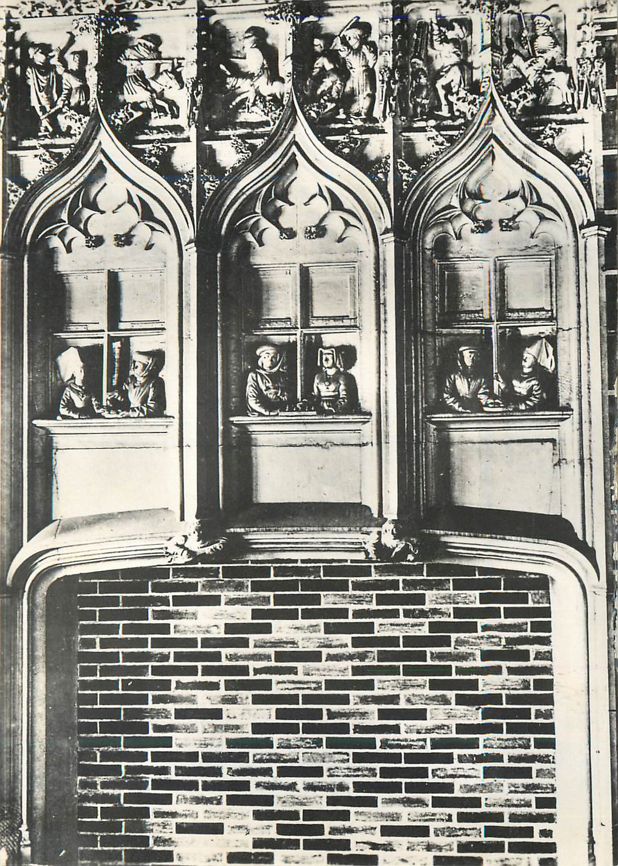 Detail of a Gothic altarpiece — sculpted figures in windows — publisher not visible