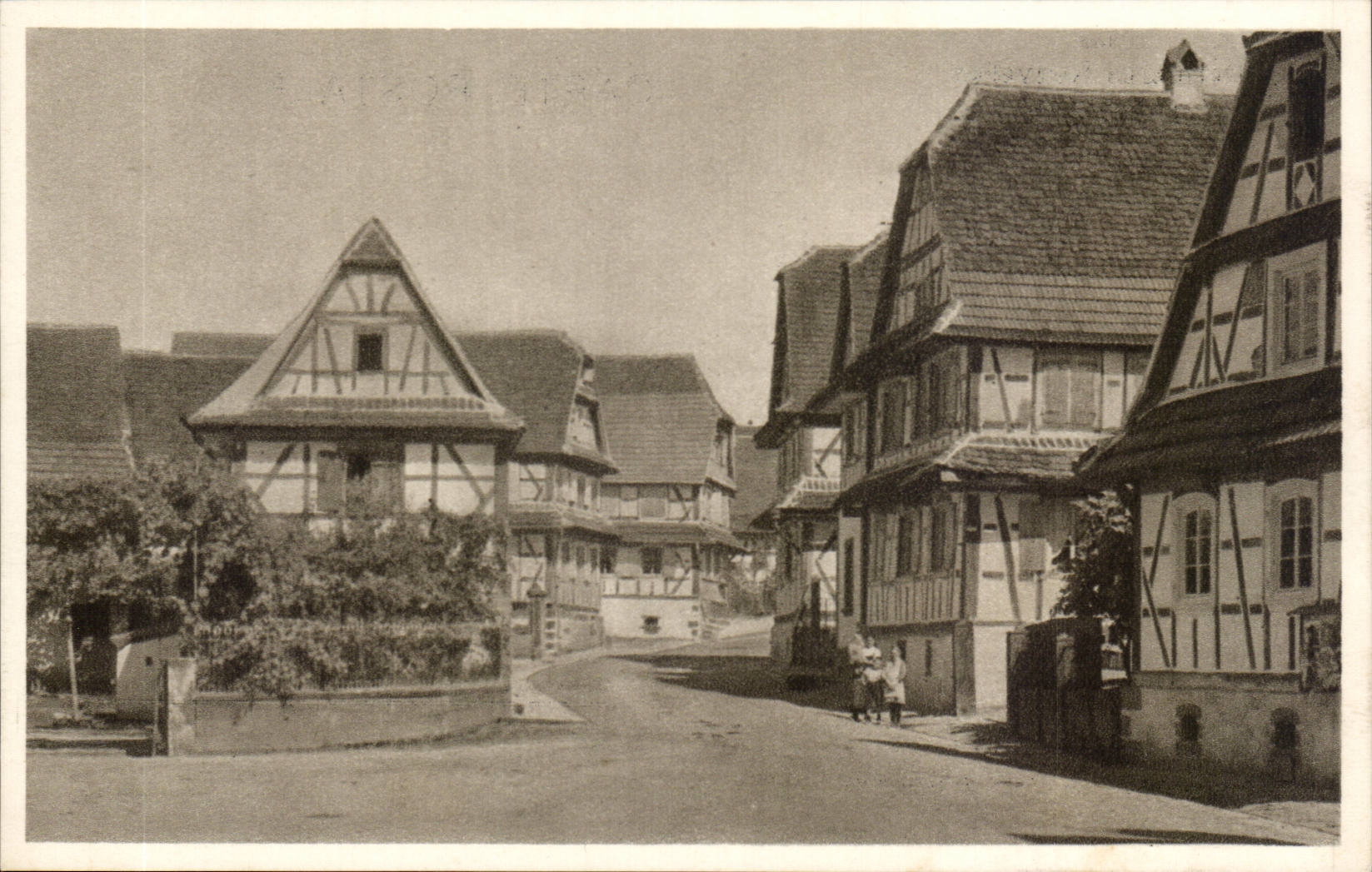 Hunspach (Bas-Rhin) — rue avec maisons à colombages — Héliogr. Dernières Nouvelles de Strasbourg, Photo Eugène Muller