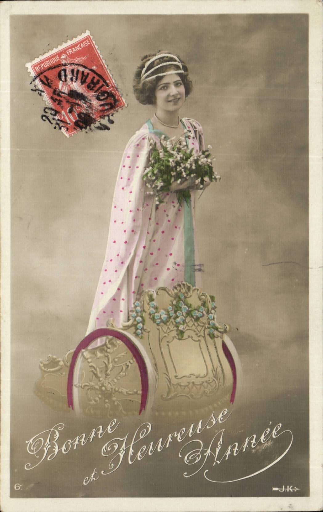 Femme en robe à pois tenant un bouquet — Bonne et Heureuse Année — J.K. — timbre 6c