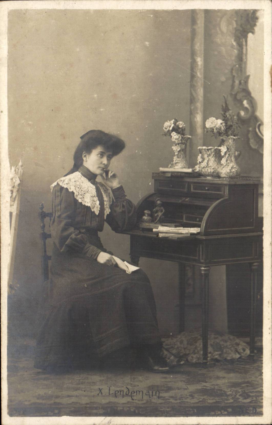 Woman Seated at a Desk — X. Lendemain — N.E.D.