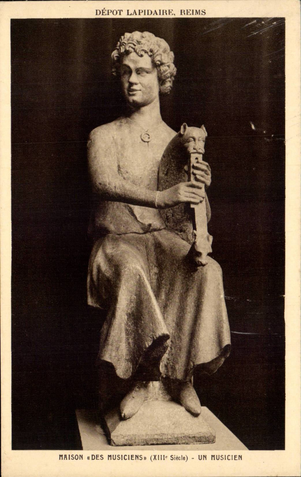 Dépôt Lapidaires, Reims — Statue d'un musicien du XIIIe siècle — Braun & Cie, Paris
