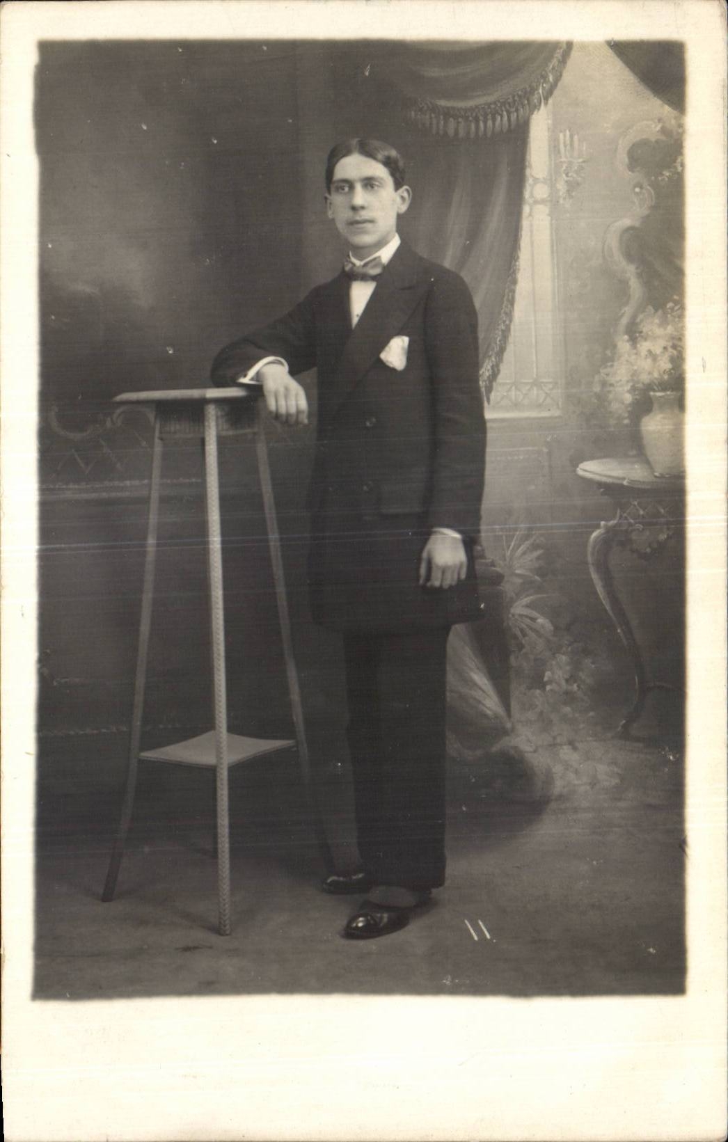 Portrait of a young man in a suit — studio — J. Paris S.