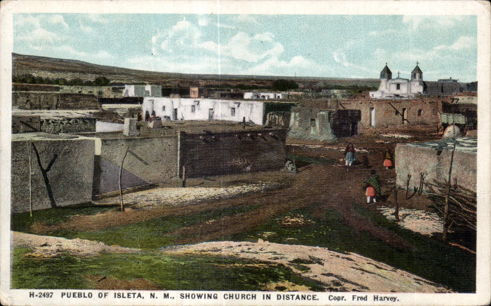 Pueblo of Isleta, N.M., showing church in distance — Fred Harvey, H-2497