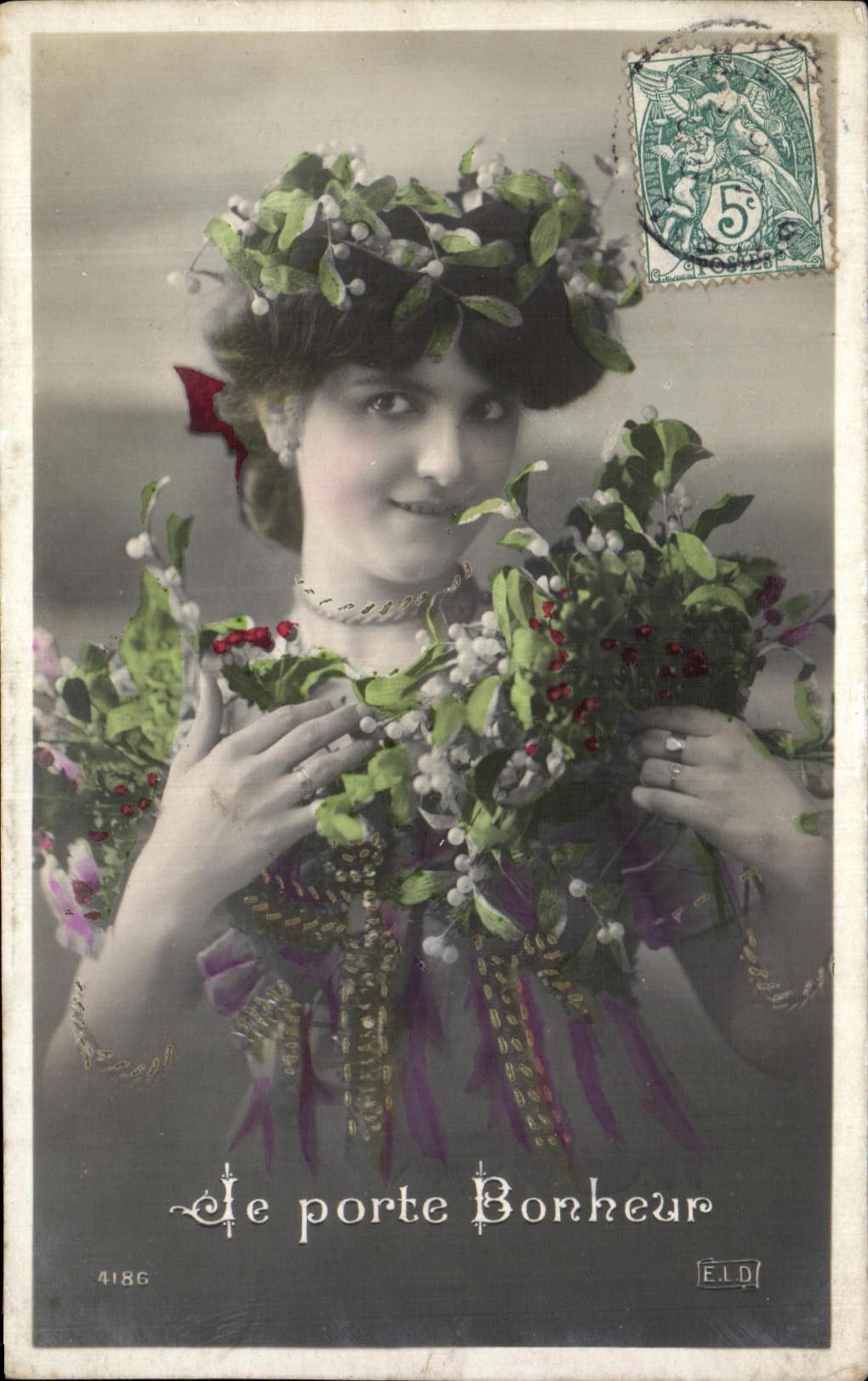 Woman wearing a crown and holly bouquet — 'The Happiness Bearer' — Publisher ELD, no. 4186