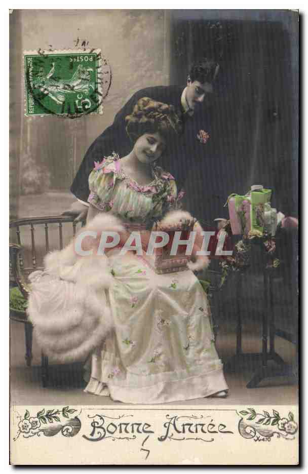 Jeune femme et homme — Bonne Année — Carte postale de Noël