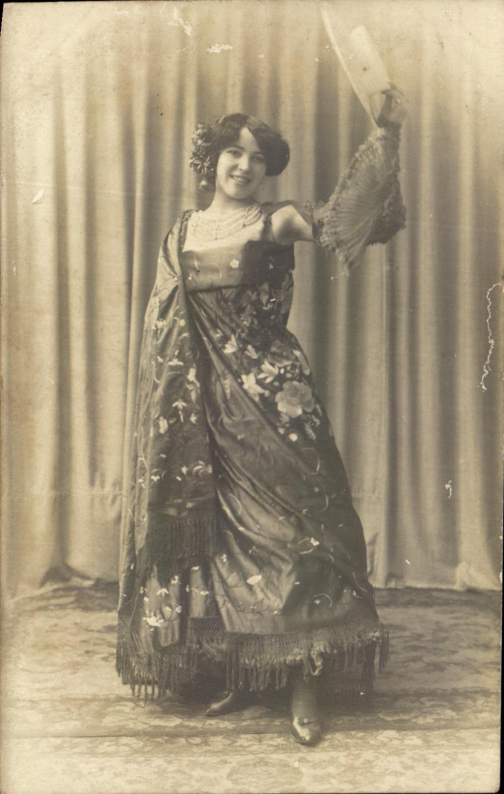 Woman in a dance costume — studio — publisher not visible