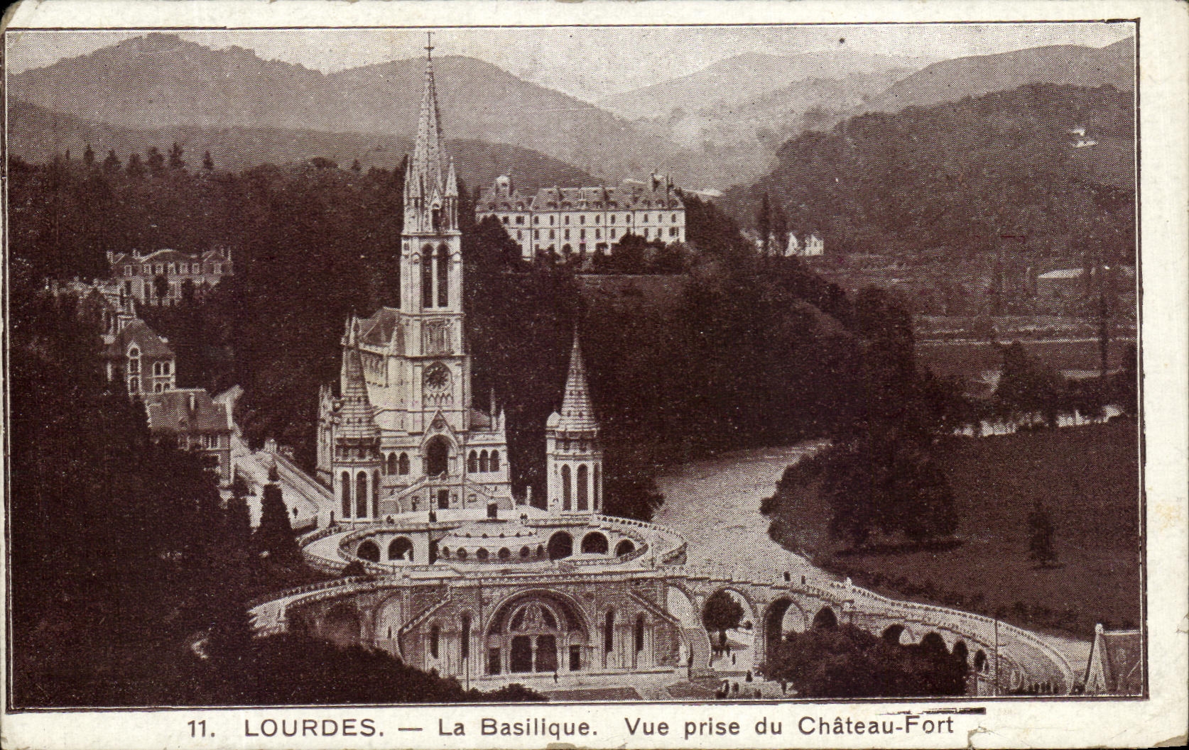CPA Lourdes La Basilique Vue prise du Chateau Fort Publicite Magasin Peyramale 