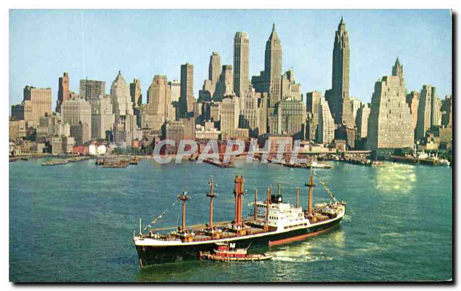 CPSM Lower Manhatton Skyline New York city Showing One Of Many Cargo Vessels That Are