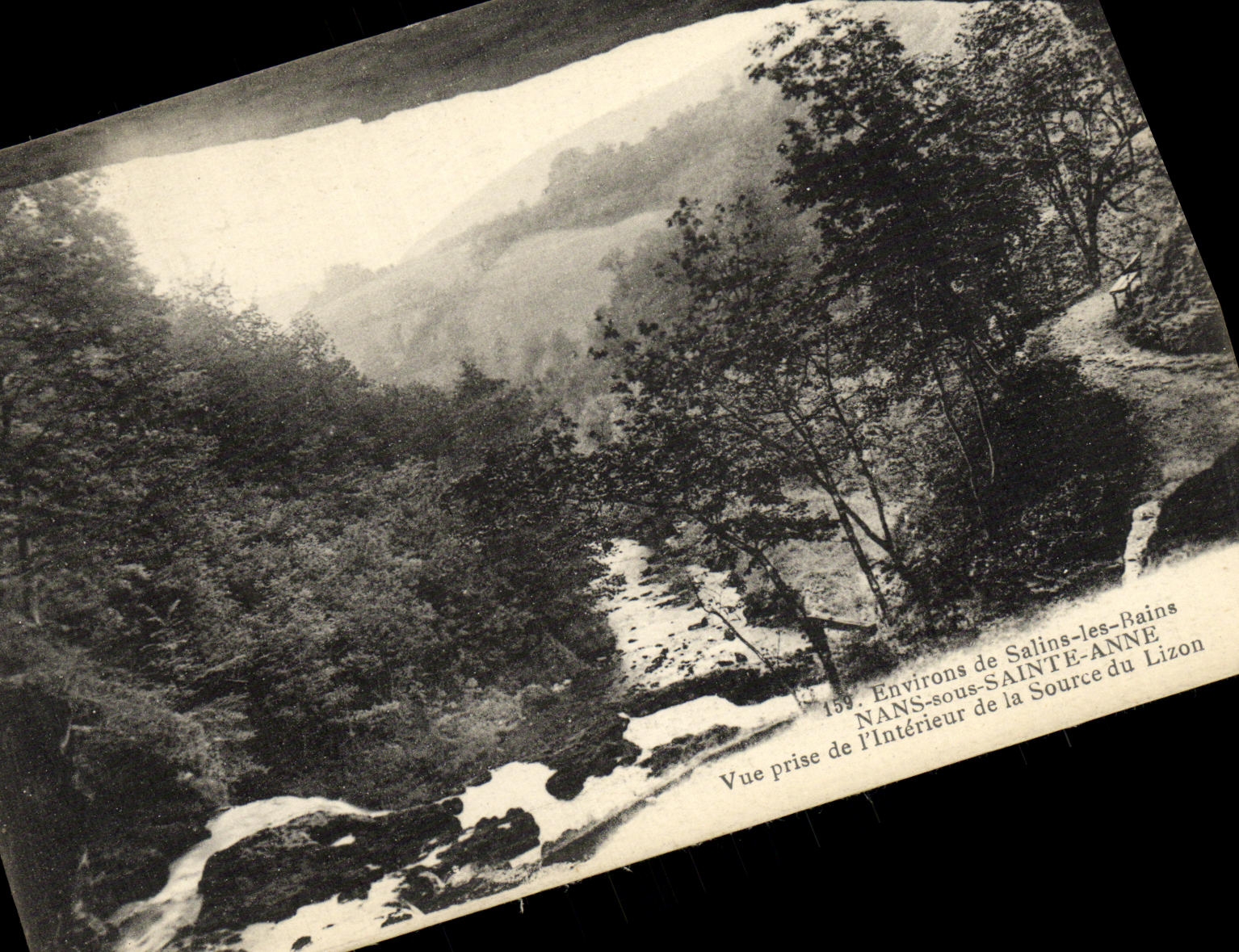 CPA Environs de Salins les Bains Nans sous Sainte Anne Vue prise de l Interieur de la Source du Lizon